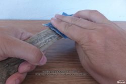 Sanding a piece of antler.