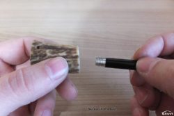 Screwing the replaceable firesteel in to the antler handle.